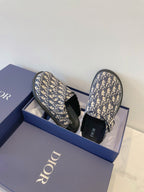 Monogram slide sandals with blue patterned upper and dark footbed