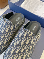 Monogram slip-on slide sandals with adjustable strap, blue-and-cream patterned upper