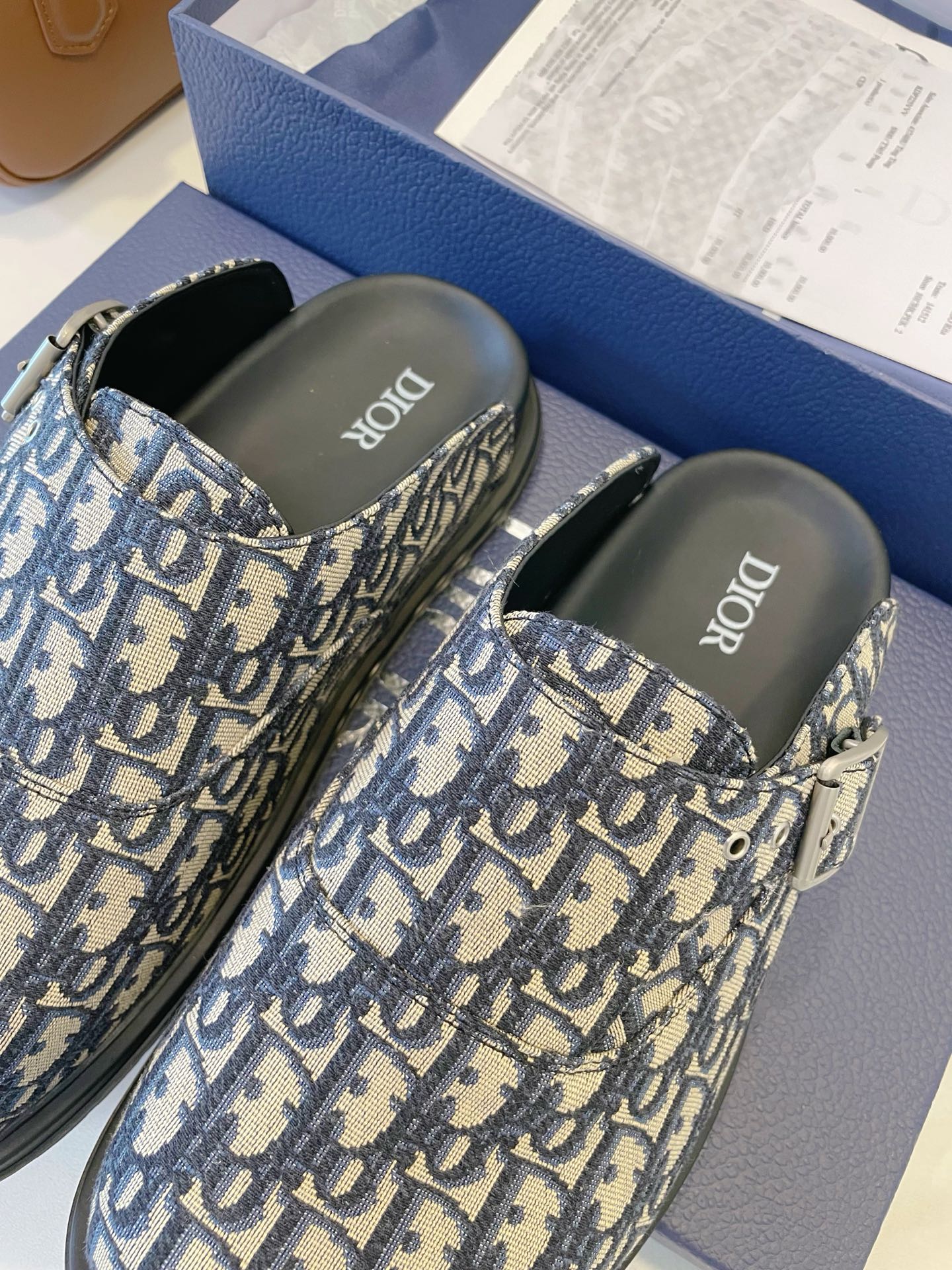 Monogram slip-on slide sandals with adjustable strap, blue-and-cream patterned upper