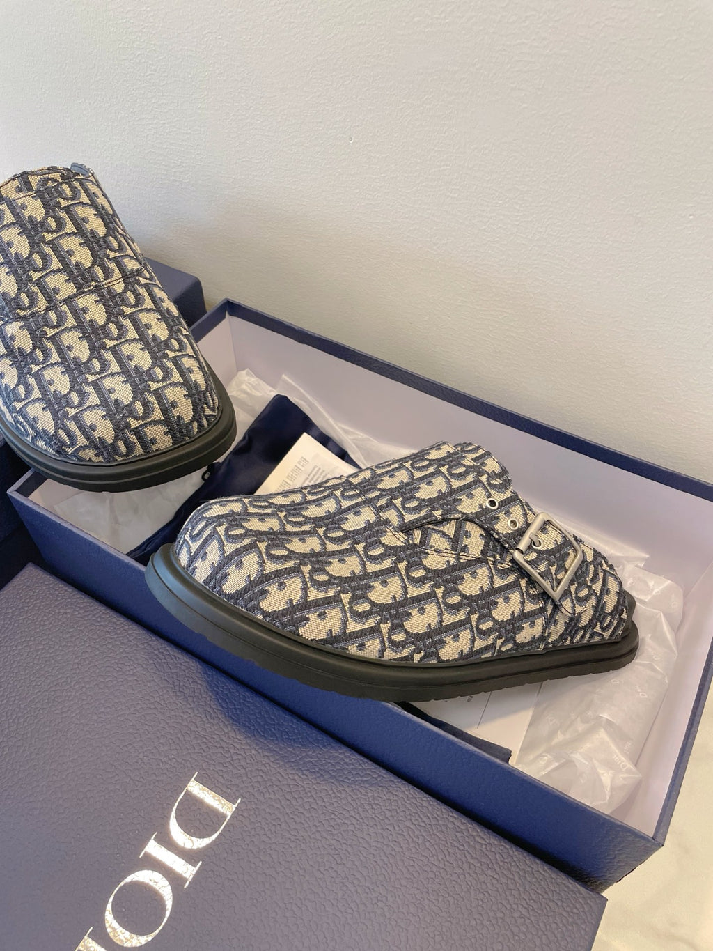 Monogram slide sandal with buckle strap, blue-and-cream patterned upper