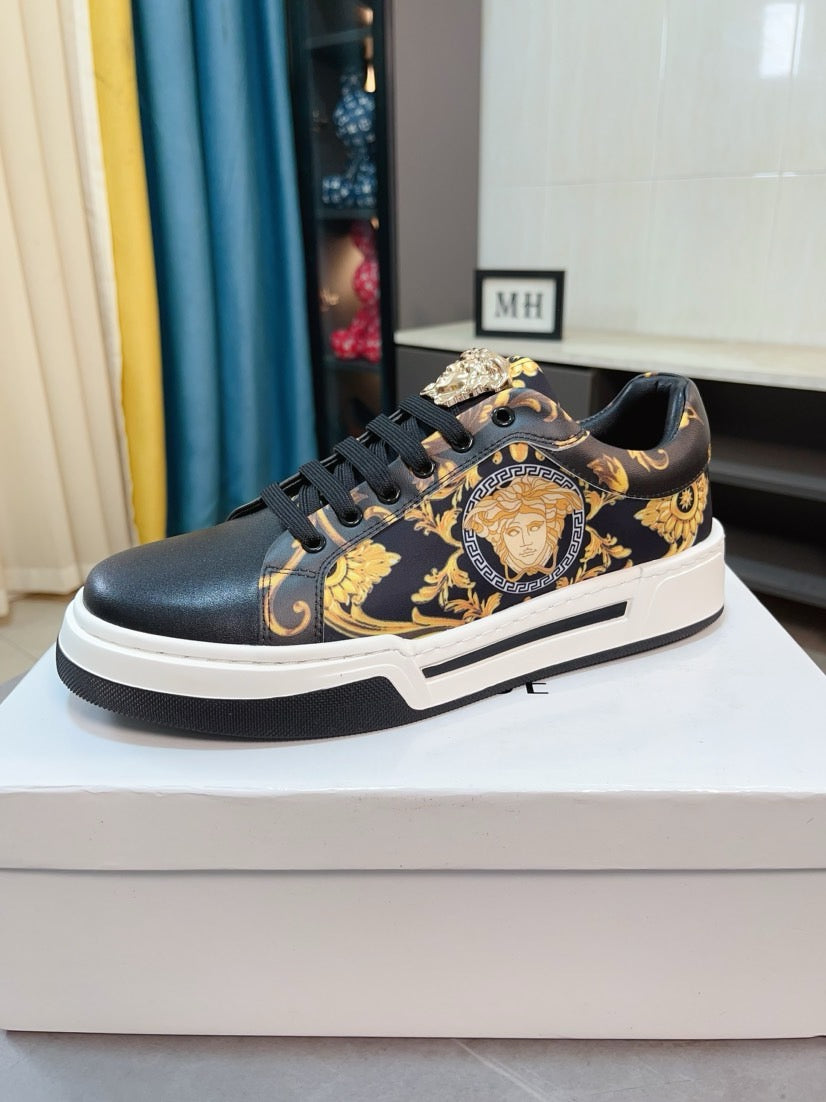 Versace sneakers, side view, dark upper with gold medallion ornament and black laces