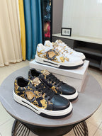 Versace sneakers in dark leather with gold baroque print and black laces