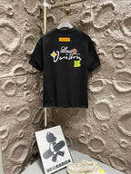 Black T-shirt back with large script graphic and logo patch