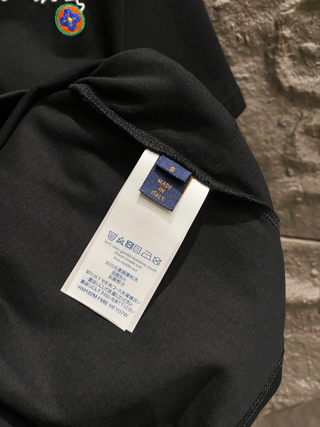 Black T-shirt fabric with inside neck label tag