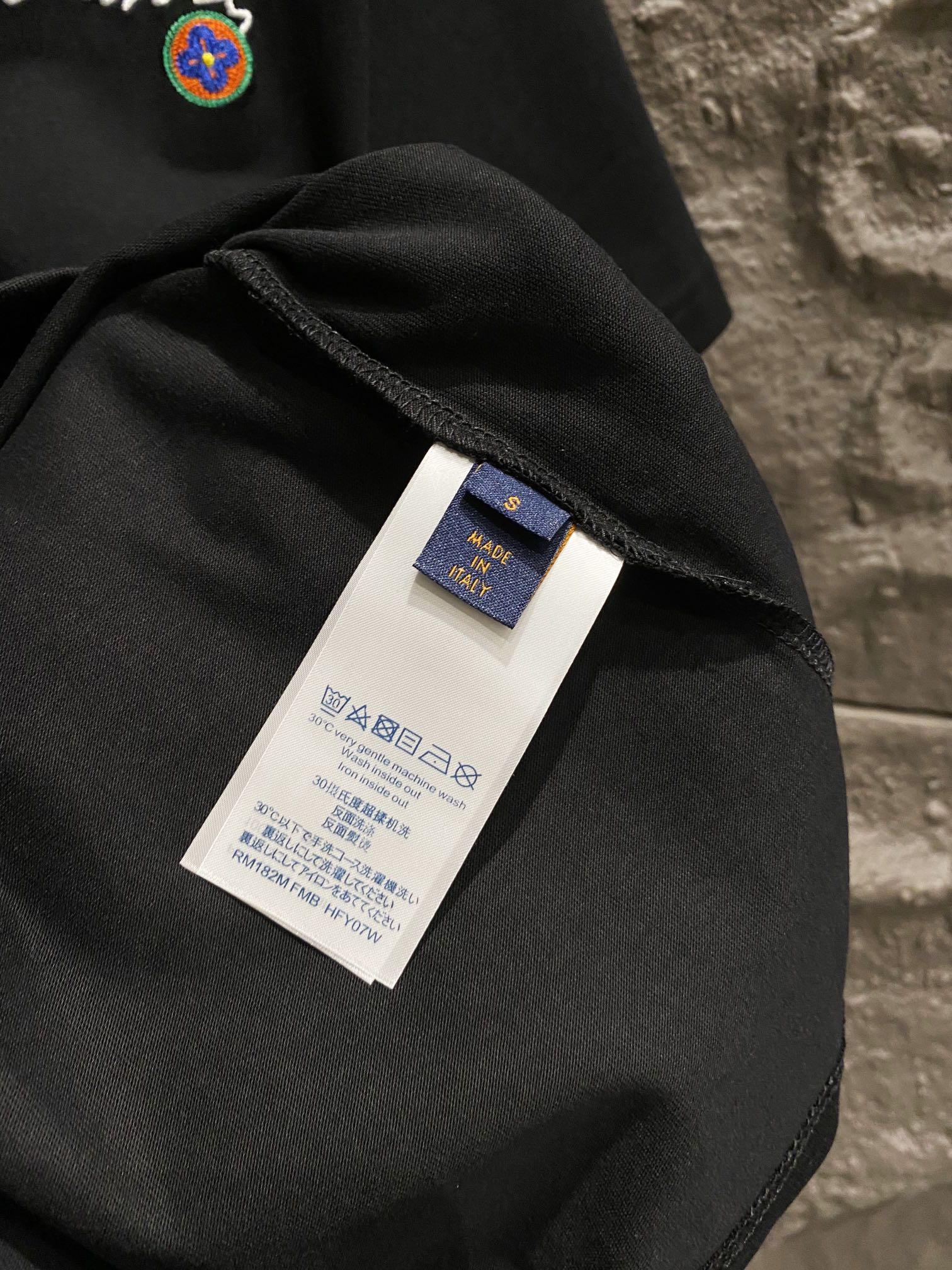 Black T-shirt fabric with inside neck label tag