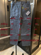 Prada denim cargo pants, light blue wash, with size markings overlaid on the garment