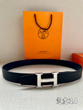 Dark blue leather belt with silver H-style buckle, flat strap end visible