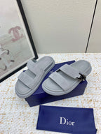 Dior slide sandals in light gray suede, side view with two straps and metal buckle