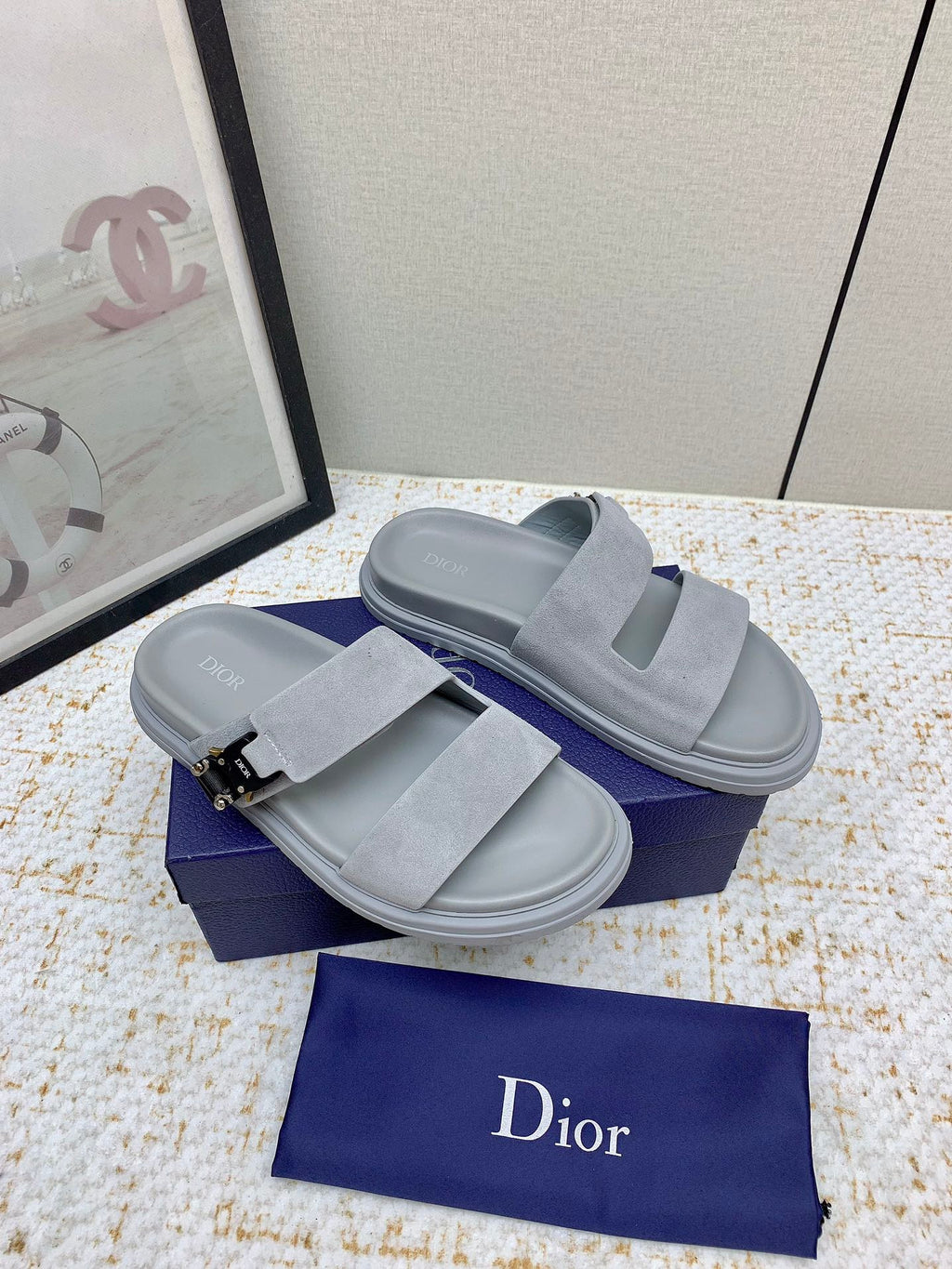 Dior slide sandals in light gray suede with two wide straps and buckle hardware