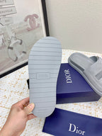 Dior slide sandal outsole, light gray rubber sole with ribbed tread