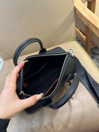Coach leather mini satchel open at top with zip closure and interior compartment