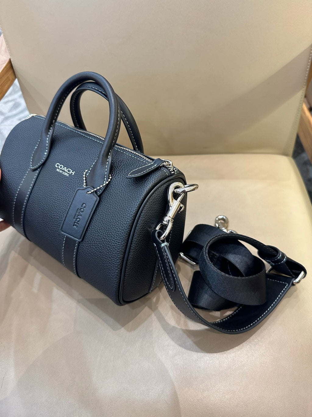 Coach leather mini satchel with top handles and crossbody strap with metal hardware
