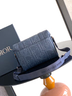 Dior blue embossed monogram flap bag with detachable shoulder strap and buckle details