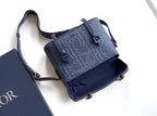 Dior blue embossed monogram crossbody bag with top flap and adjustable shoulder strap
