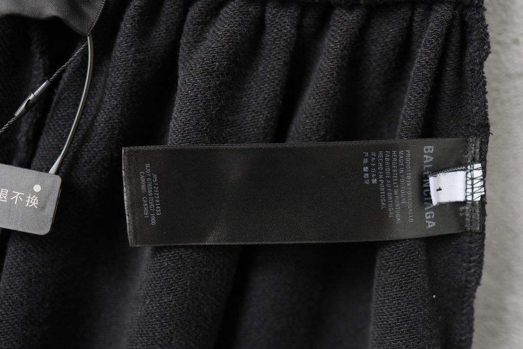 Balenciaga dark shorts with inside waistband and care label close-up