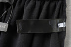 Balenciaga dark shorts with inside waistband and care label close-up