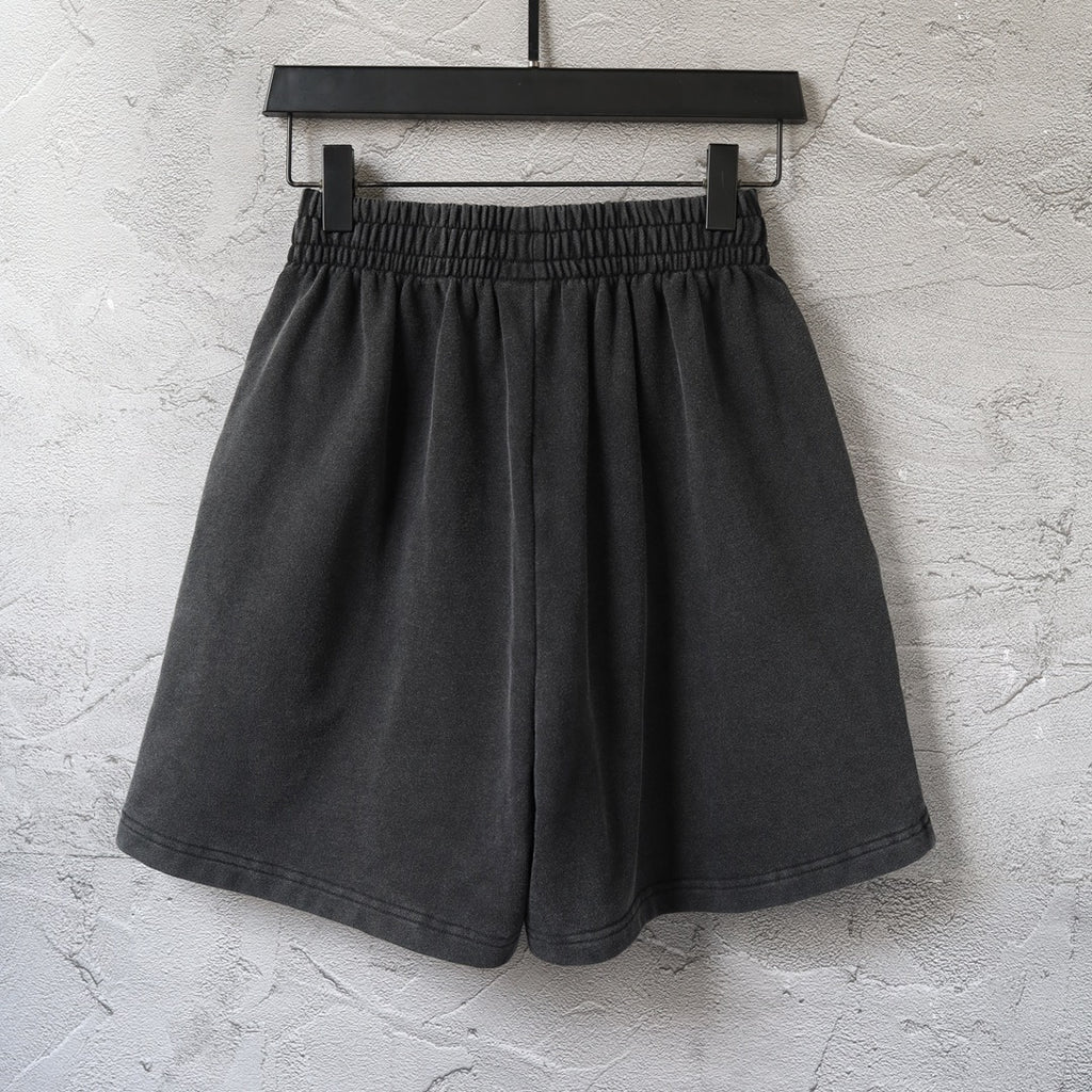Balenciaga dark shorts on hanger with elastic waistband and pleated front