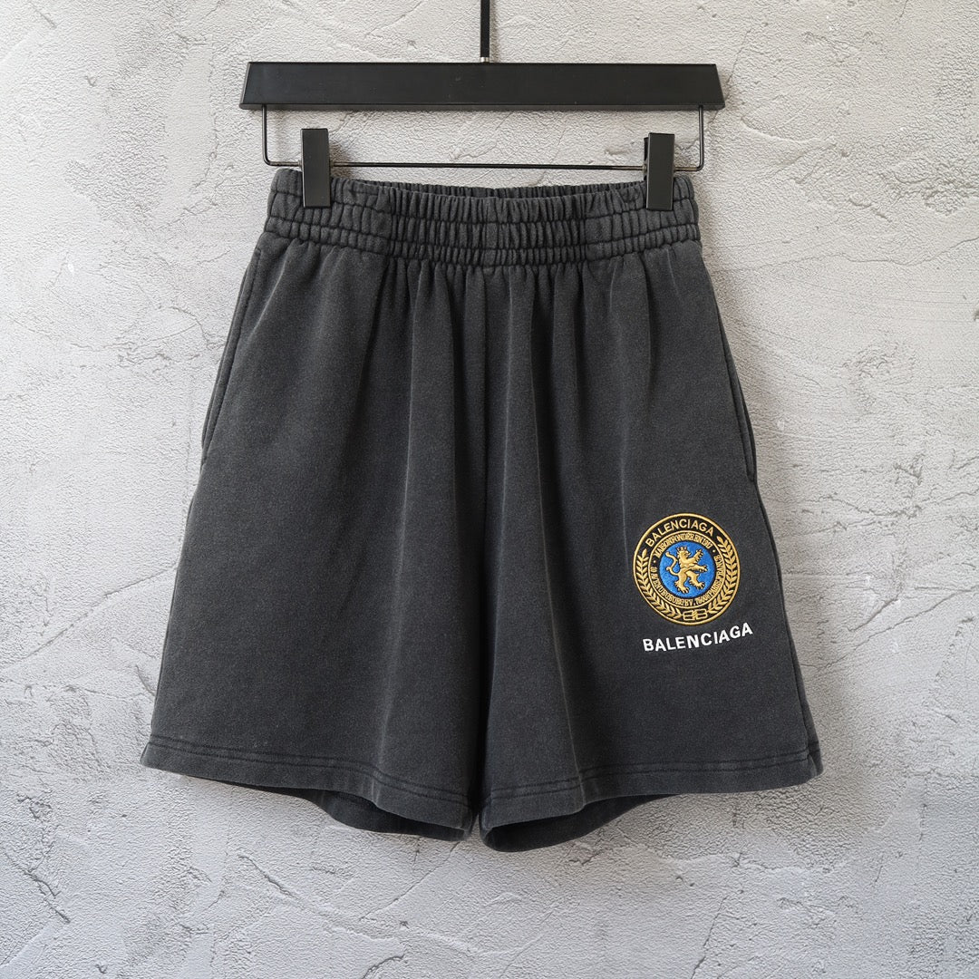 Balenciaga dark shorts with elastic waistband and front pleats