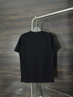 Black crewneck T-shirt, plain back view on a hanger.