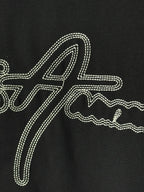 Black T-shirt with large rhinestone script graphic across the front.