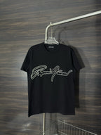 Black crewneck T-shirt with rhinestone script logo on the front.