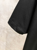 Black short-sleeve T-shirt with stitched hem and sleeve cuff seam detail