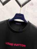 Black short-sleeve T-shirt with red Louis Vuitton logo and blue neckline tag