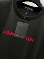 Black short-sleeve T-shirt with red Louis Vuitton text logo and hanging tag