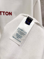 White T-shirt fabric close-up showing inner size and care label.