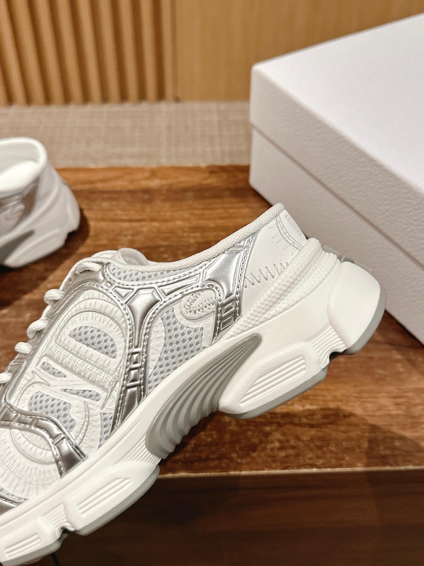 White Dior sneaker heel and side profile with chunky sole