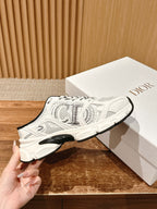 White sneaker held beside a box; chunky sole and black heel lining