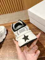 White sneaker with Dior text on heel tab and black star patch