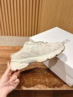 White lace-up sneaker on shoebox, star-like logo detail and chunky outsole