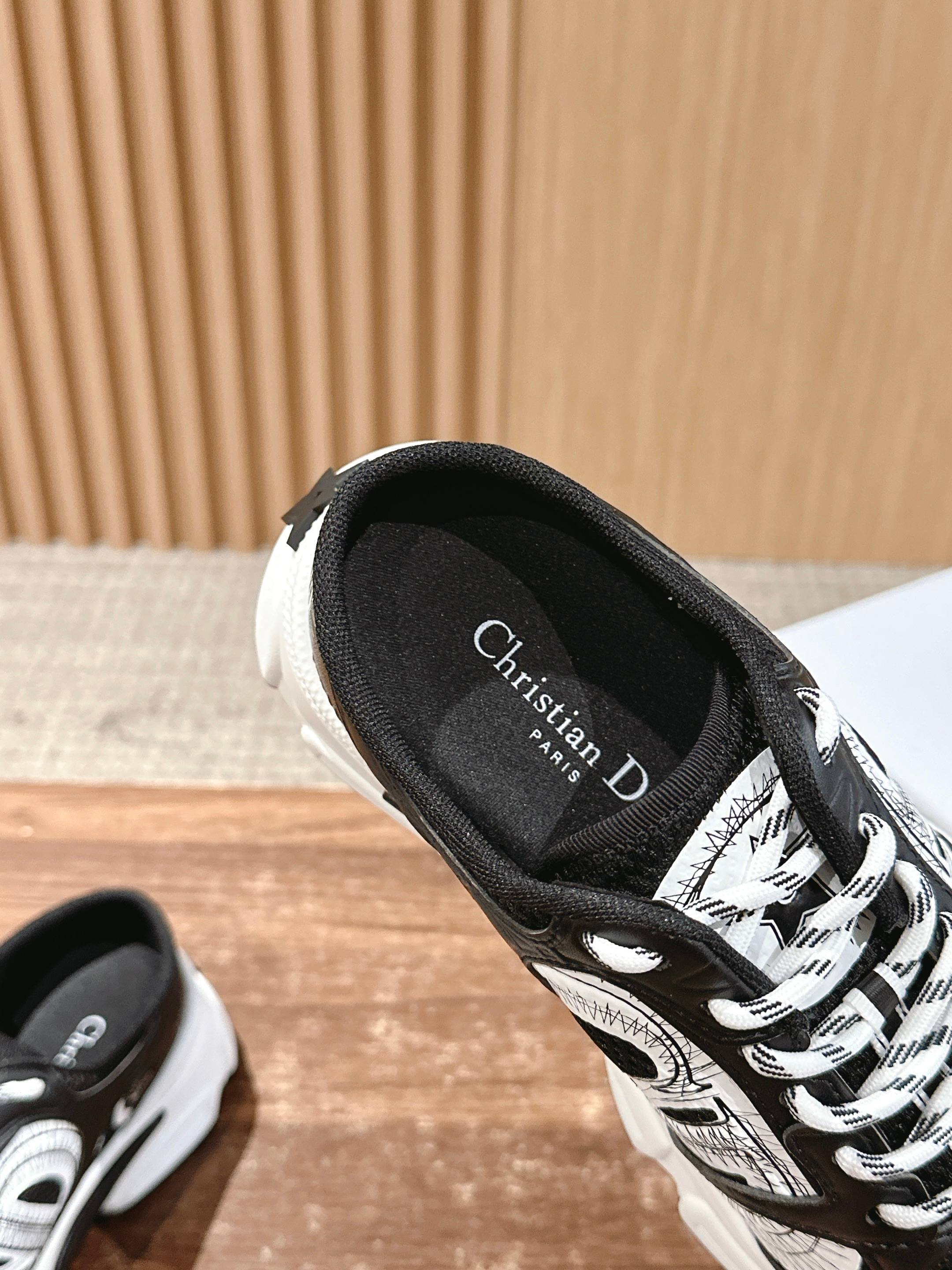 Dior lace-up sneaker heel and tongue close-up with black lining