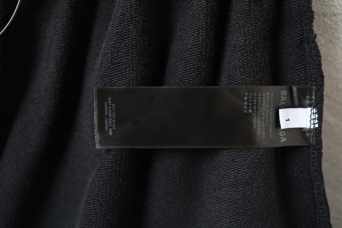 Black Balenciaga shorts with interior fabric label near the waistband