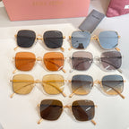 Assorted square sunglasses with gold and clear frames, multiple lens tints