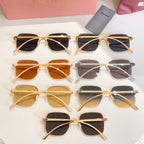 Assorted square sunglasses laid out, gold and transparent frames with dark lenses