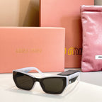 MiuMiu sunglasses with white frames and dark lenses.