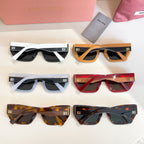 Set of six MiuMiu sunglasses with mixed frames and dark lenses.