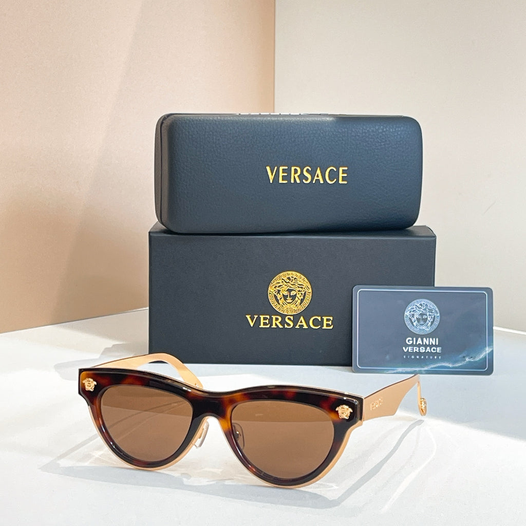 Versace sunglasses, tortoiseshell cat-eye frames with brown tinted lenses and gold details