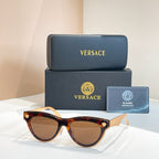 Versace sunglasses, tortoiseshell cat-eye frames with brown tinted lenses and gold details