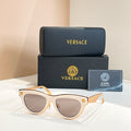 Versace sunglasses, white cat-eye frames with gray lenses and gold logo temples