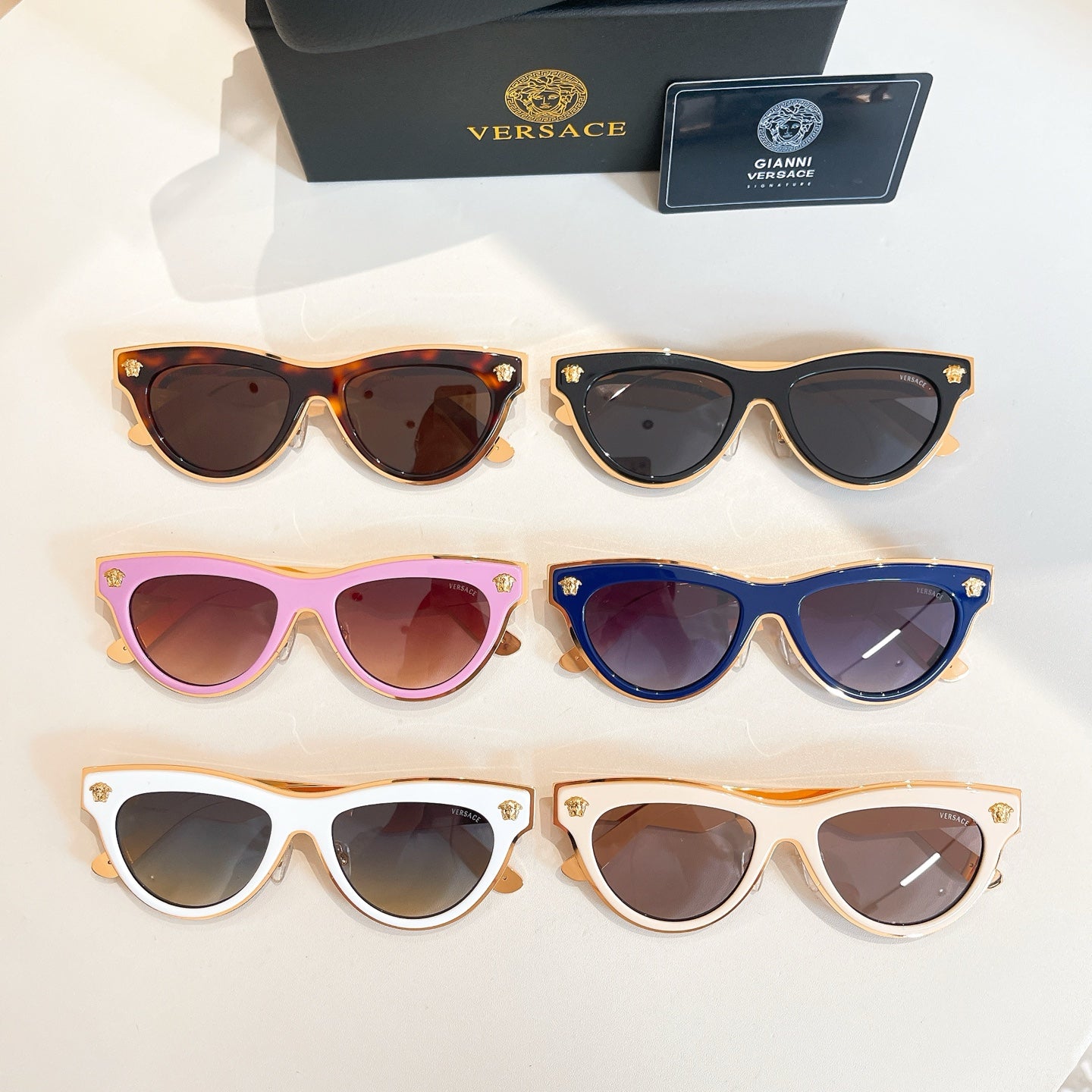 Versace sunglasses assortment, multiple cat-eye frames with tinted lenses in 6 colors
