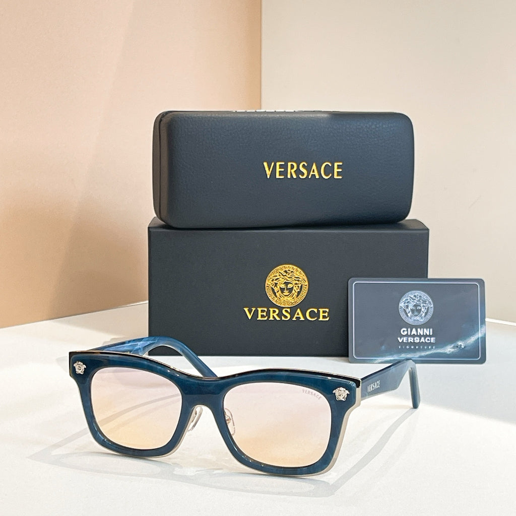Versace sunglasses with blue frames, square lenses, and gold emblem temple tips