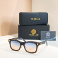 Versace sunglasses with dark frames, square lenses, and gold emblem temple tips