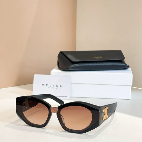 Black cat-eye sunglasses with gold logo detail and amber-tinted lenses.