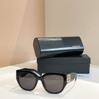 Black sunglasses with dark lenses and wide square frame