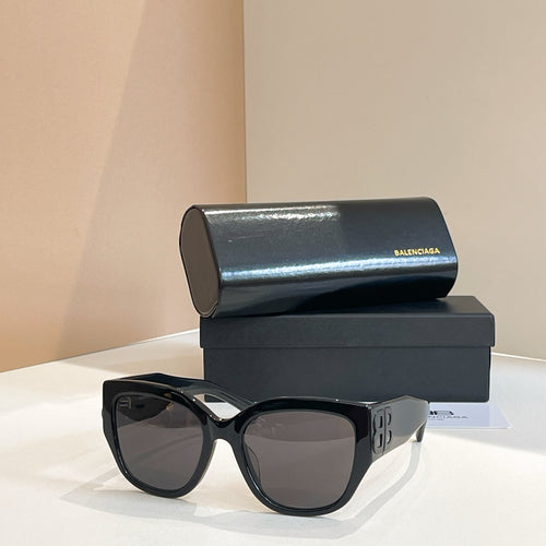 Black sunglasses with dark lenses, wide square frame, and side "B" logo