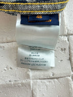 Denim shorts care label with size 46 and wash instructions