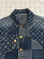 Louis Vuitton denim jacket close-up with blue monogram collar and gold button detail